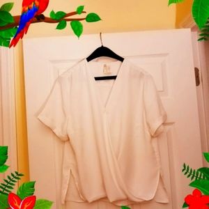 Beautiful white blouse Kriss Kross on the front.